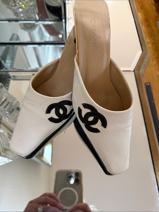 CHANEL Shoes - CHANEL White Quilted Leather Slip-On Mules with Black CC Logo